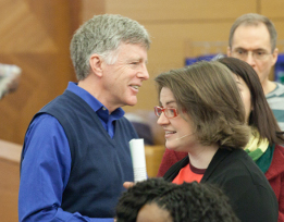 Co-pastors Ken Wilson (left) and Emily Swan (right) prepare for a membership service.